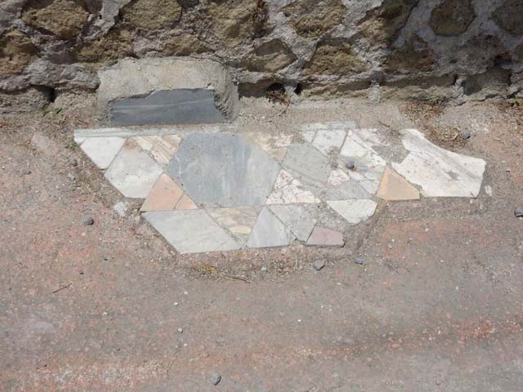 IV.21, Herculaneum. May 2018. Room 15, remains of flooring near west wall. Photo courtesy of Buzz Ferebee. 