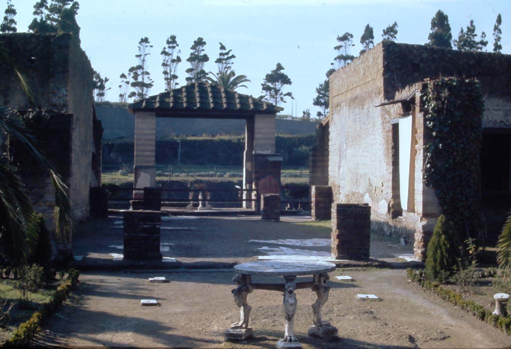 IV.21, Herculaneum. 4th December 1971. Large triclinium 15, looking south from garden area 32. 
Photo courtesy of Rick Bauer, from Dr George Fay’s slides collection.
