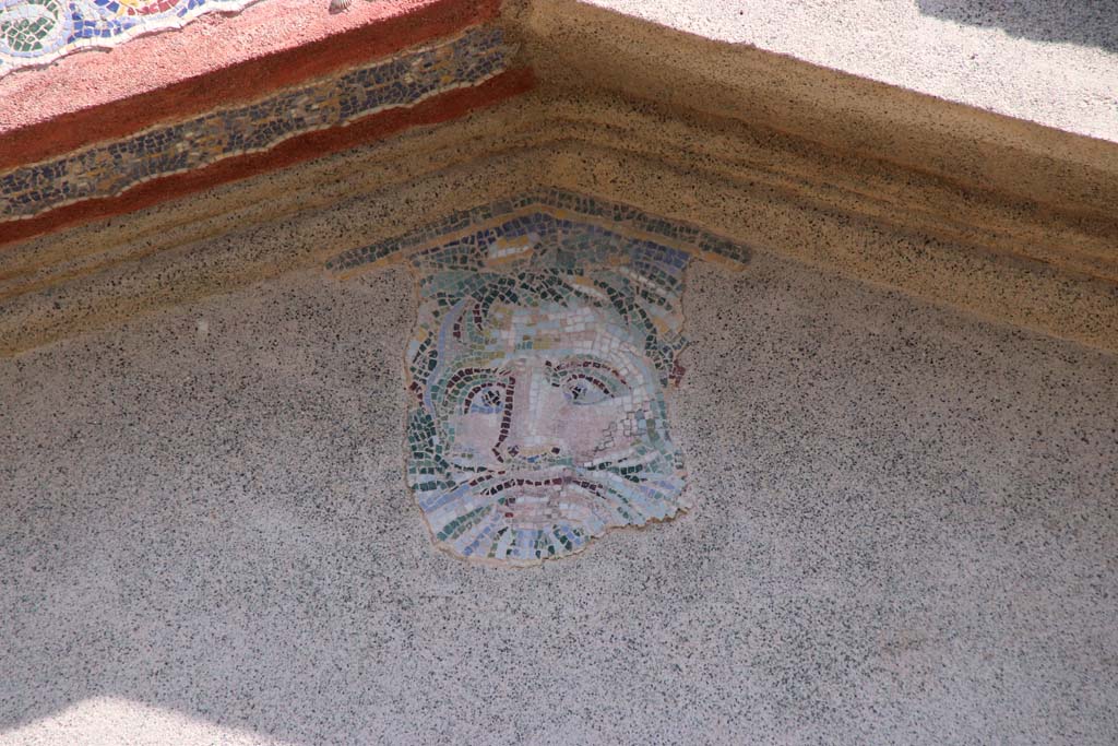 IV.21, Herculaneum, September 2019. 
Detail of the head of Oceanus from the upper centre of the great portal of Garden 32. Photo courtesy of Klaus Heese.
