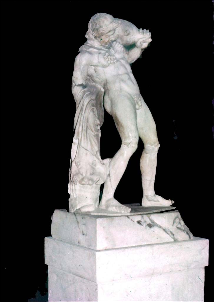 IV.21, Herculaneum. June 1962. Statue of Satyr with a Wineskin. 
Photo by Brian Philp: Pictorial Colour Slides, forwarded by Peter Woods
(H42.16B Herculaneum Satyr with a Wineskin in Deer House).
