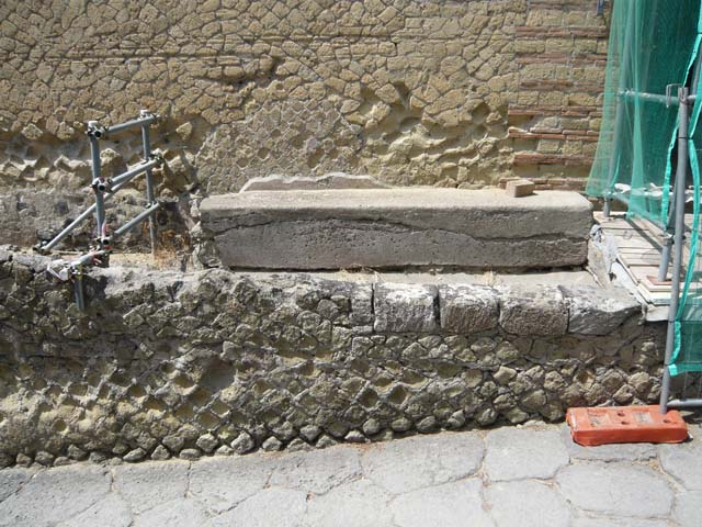 IV.21, Herculaneum, August 2013. Bench on south side of entrance doorway. Photo courtesy of Buzz Ferebee.  
