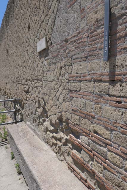 IV.21 Herculaneum, June 2017. Bench seat on south side of entrance doorway.
Photo courtesy of Michael Binns.
