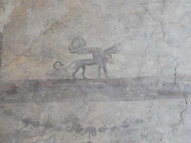 IV.21, Herculaneum. May 2018. Room 24, detail of painted decorations from upper west wall of atrium.
Photo courtesy of Buzz Ferebee. 

