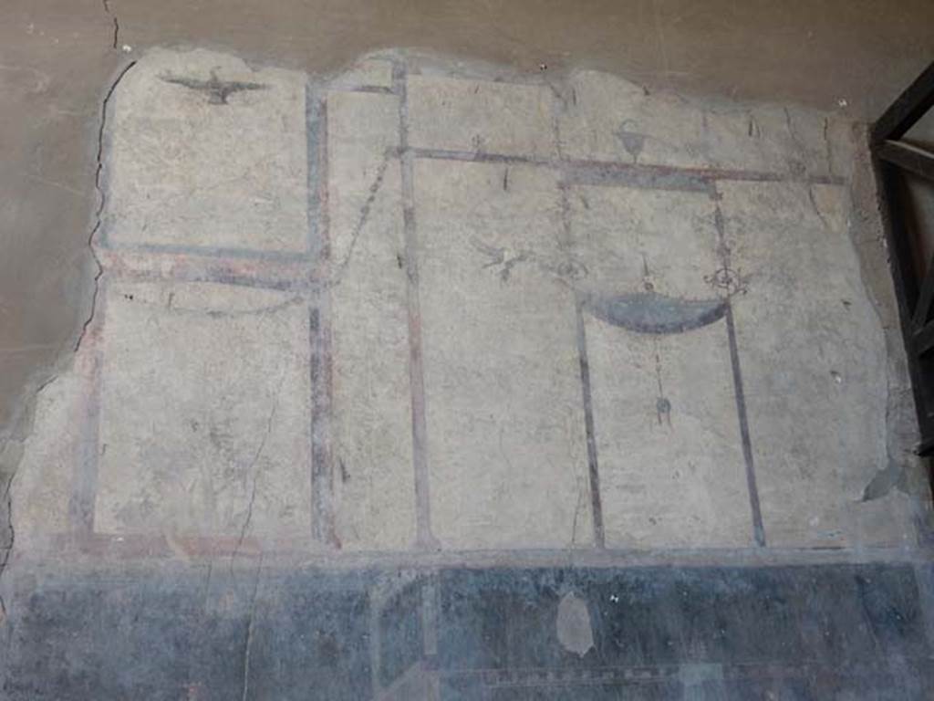 IV.21, Herculaneum. October 2020. Room 24, painted decoration of bird/eagle from panel on upper west wall in atrium. Photo courtesy of Klaus Heese.