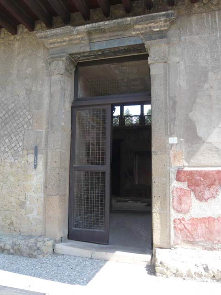 V.1 Herculaneum. August 2013. Entrance doorway. Photo courtesy of Buzz Ferebee.
The door jambs in opus quadratum are topped with Corinthian capitals.


