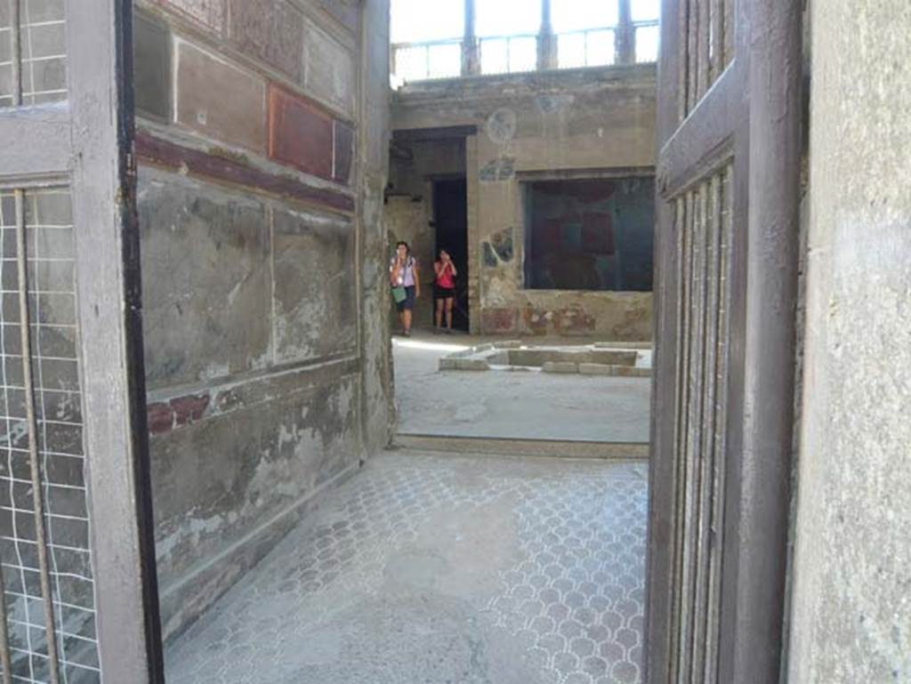 V.1, Herculaneum, October 2014. Room 3, west end of north wall with wall painting of Rape of Europa.  Photo courtesy of Michael Binns.
