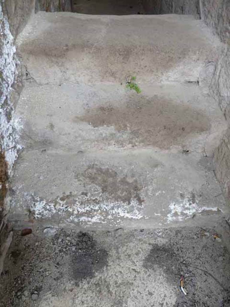 V 2, Herculaneum, October 2014. View from doorway, above stone steps, which would have continued to the upper floor. Photo courtesy of Michael Binns.
