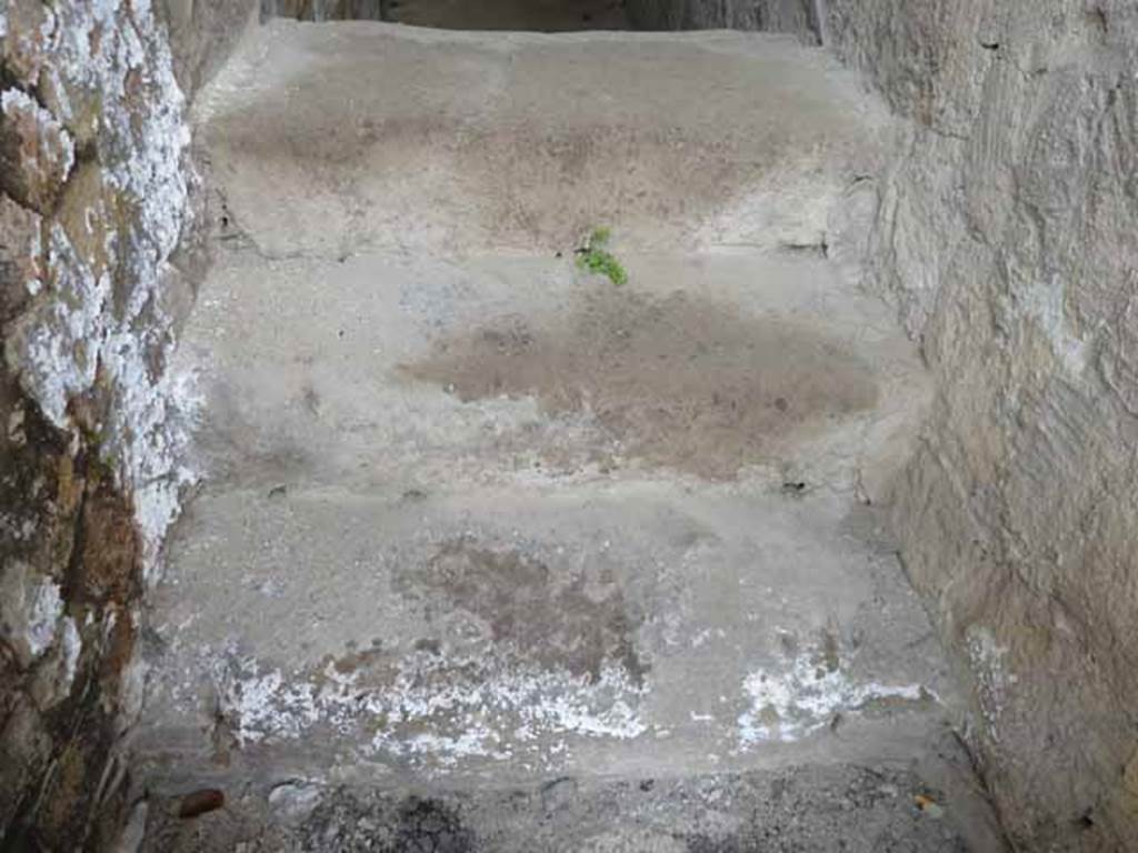 V.2, Herculaneum. May 2010. View from doorway, above stone steps, which would have been the steps to upper floor.