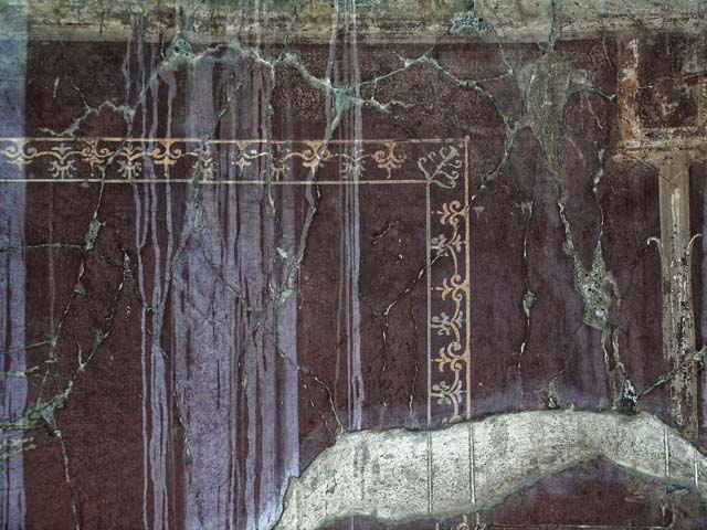 V.5, Herculaneum. May 2005. Room 8, detail of painted panel at west end of north wall, with edging of a carpet border.  
Photo courtesy of Nicolas Monteix.
