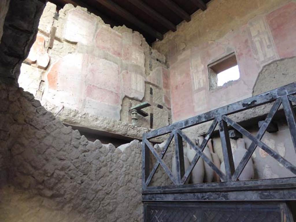 V 6, Herculaneum, August 2013. Detail of amphorae from upper floor at north end of east side of shop. Photo courtesy of Buzz Ferebee. 

