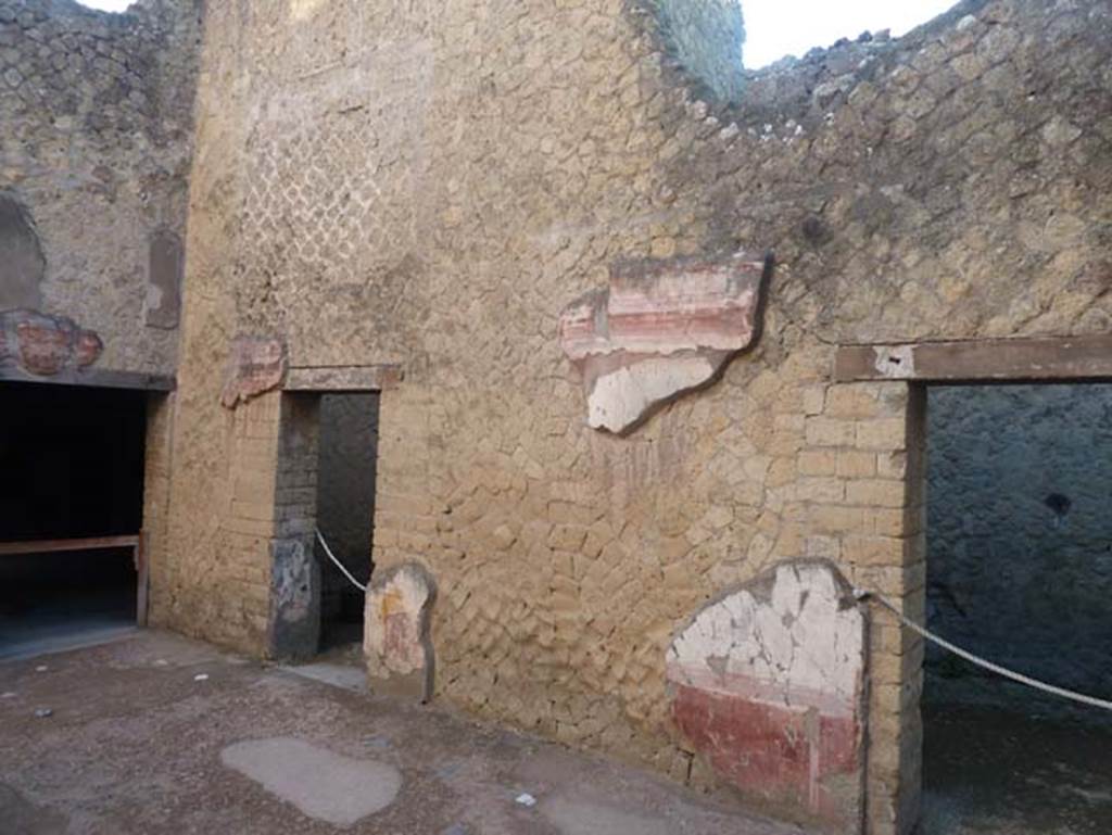 Ins. V 7, Herculaneum, September 2015. Looking towards south-east corner of atrium, with the doorway to triclinium, on left. The doorway, left of centre, leads into the cubiculum
