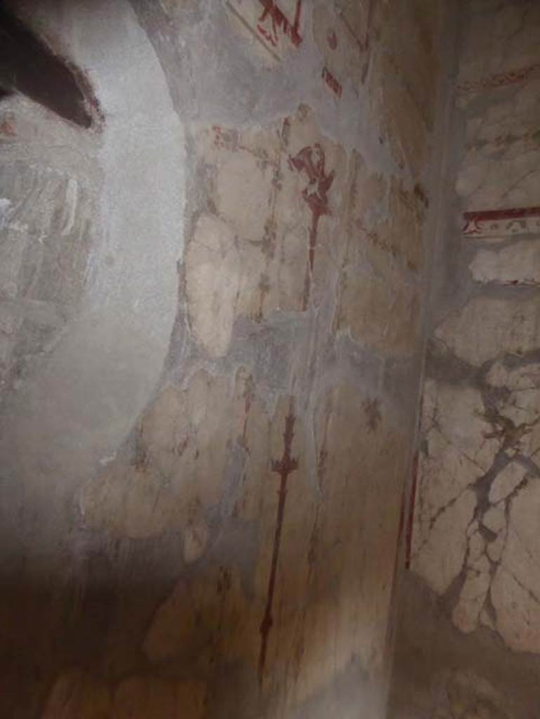 V.8, Herculaneum. October 2014. Painted wall decoration from room on west of corridor.  Photo courtesy of Michael Binns.
