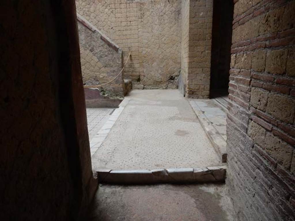 V.8 Herculaneum, May 2018. Area 4, looking east from corridor and across courtyard to steps. 
The doorway to Room 7 is on the right.  Photo courtesy of Buzz Ferebee.
