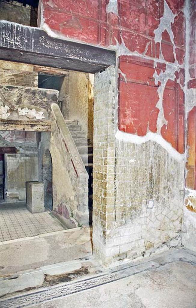 V.8 Herculaneum. October 2001. Room 7, looking north through east side of doorway into the courtyard, with steps to upper landing.  Photo courtesy of Peter Woods.
