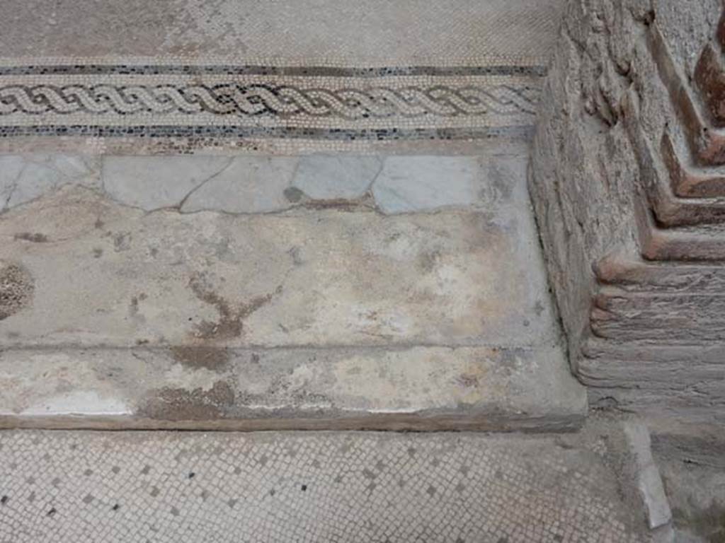 V.8 Herculaneum. May 2018. Room 7, doorway threshold at east end of central doorway. 
Photo courtesy of Buzz Ferebee.
