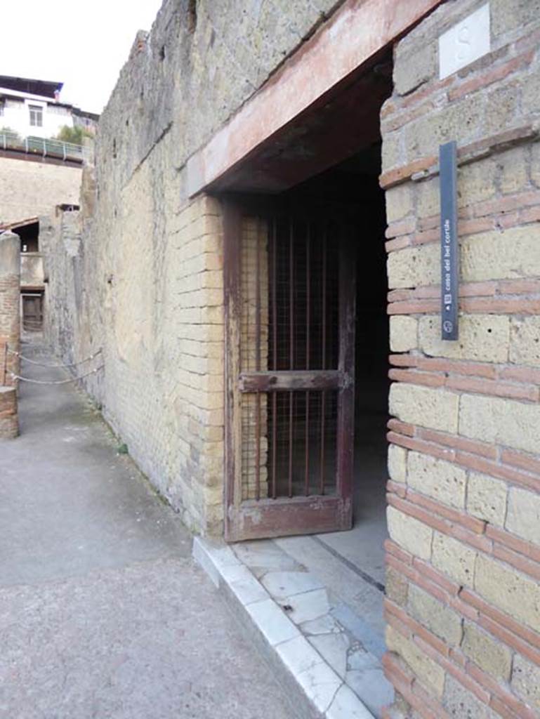 V.8, Herculaneum. October 2014. Looking towards entrance doorway on east side of Cardo IV. Superiore. Photo courtesy of Michael Binns.
According to Maiuri, this house of small proportions was particularly interesting because of the novelty of its plan. There is no vestibule or entrance fauces, instead of which one enters a low wide rectangular room which leads to other rooms.
See Maiuri, Amedeo, (1977). Herculaneum. 7th English ed, of Guide books to the Museums Galleries and Monuments of Italy, No.53 (p.45).

