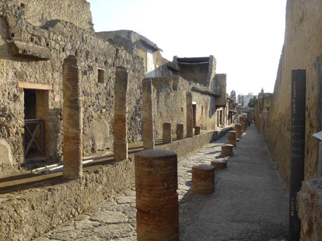 V.8 Herculaneum, September 2015. Looking south along Cardo IV Superiore. Doorway to V.8 is on the left at the far end of the columns.