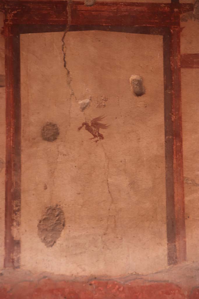 V.15, Herculaneum. October 2020. 
Upper painted detail from centre of west wall in atrium. Photo courtesy of Klaus Heese.
