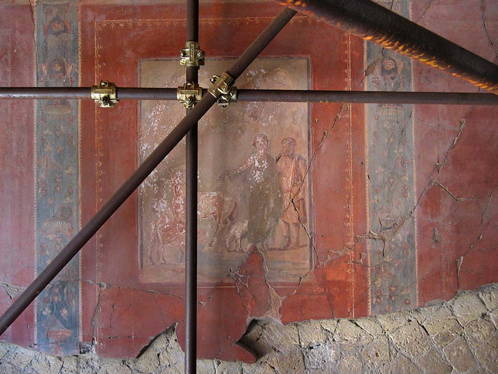V.15 Herculaneum. 2004. Centre of west wall of tablinum with painting of Daedalus and Pasiphae.