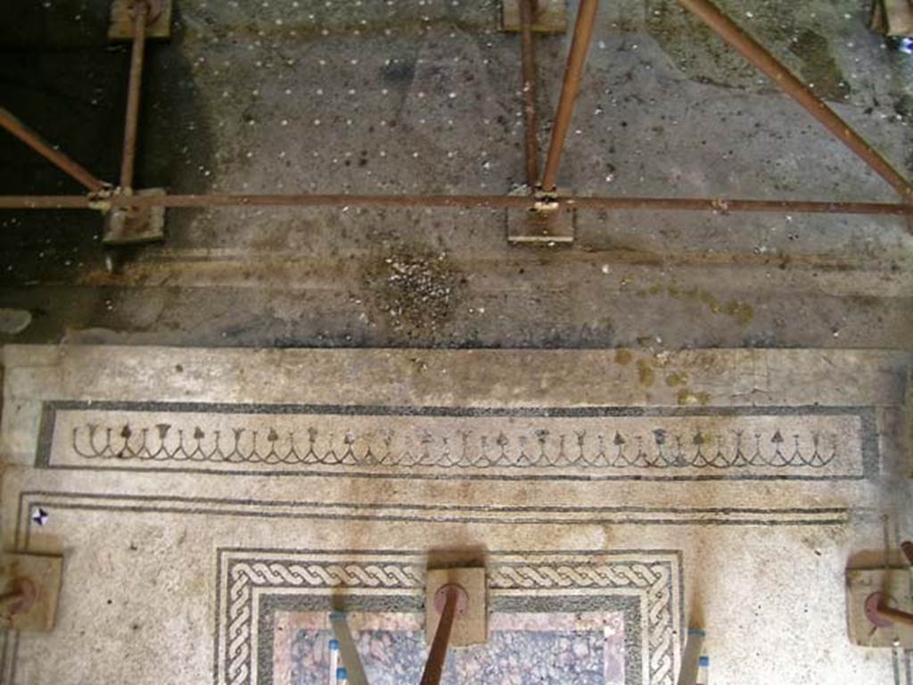V.15 Herculaneum. May 2004. Tablinum, threshold, lower, and atrium flooring above. Photo courtesy of Nicolas Monteix.

