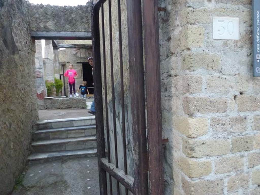 V.30 Herculaneum, October 2012. Entrance doorway, with steps at west end of entrance corridor. Photo courtesy of Michael Binns.