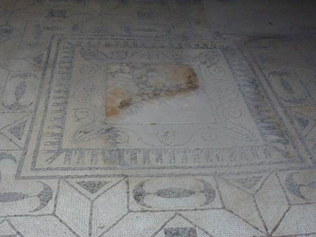 V.30 Herculaneum, October 2012. Oecus 1, flooring of black and white mosaic, and emblema in centre made of yellow “marmo antico”.  Photo courtesy of Michael Binns.
