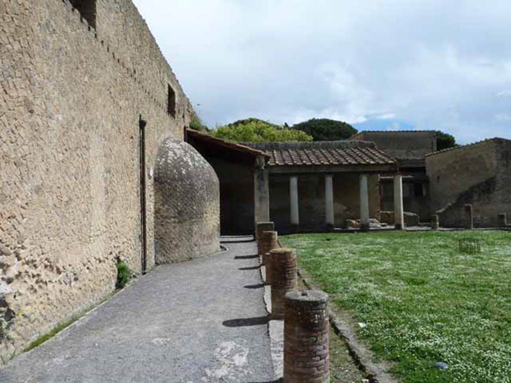 VI.1/7. May 2010. Looking east along north wall of portico of palaestra. According to Maiuri, the portico of the palaestra would also have served as a rest room where the clients of the Baths awaited their turn. 
