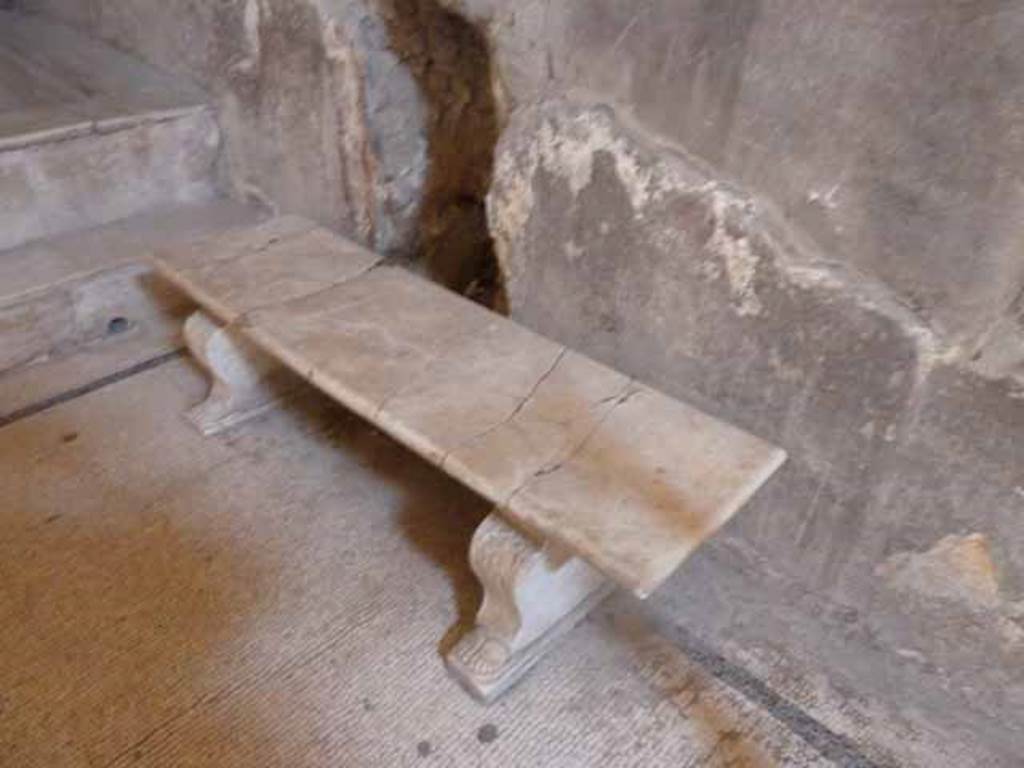 VI.8, Herculaneum. May 2010. Marble bench on east side.