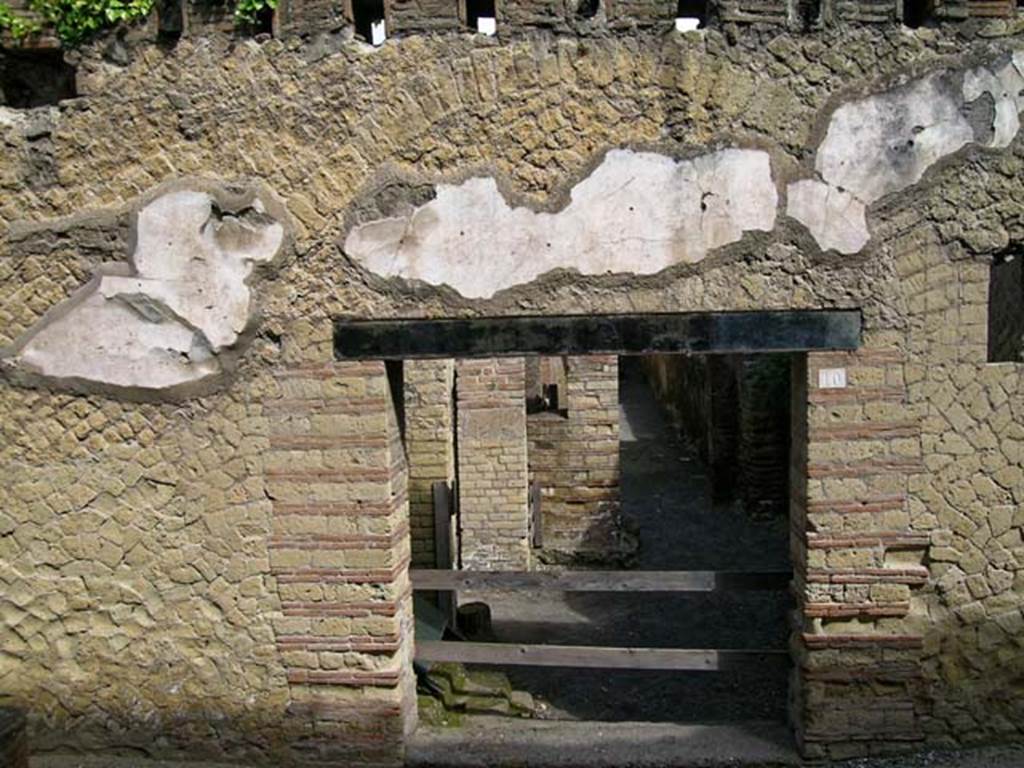 VI.10, Herculaneum. May 2004. Entrance doorway and facade on west side of Cardo IV.
Photo courtesy of Nicolas Monteix.
