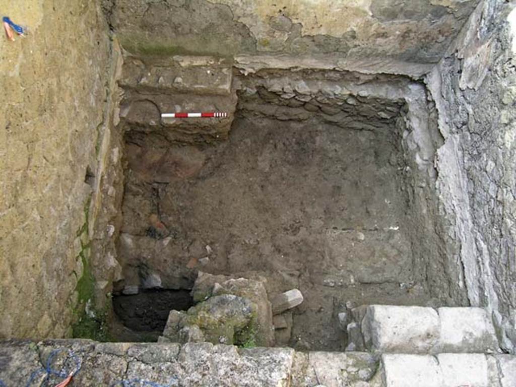 VI.12, Herculaneum. September 2005. Investigation of floor in rear-room (5).
Looking down on floor of rear room, with steps down in north-west corner, in lower right. 
Photo courtesy of Nicolas Monteix.
