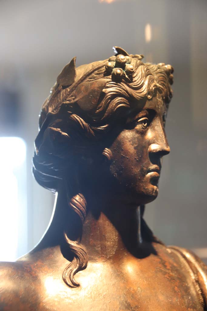 VI.12 Herculaneum. October 2020.  
Detail of head of bronze statuette of Bacchus. On display in Antiquarium. Photo courtesy of Klaus Heese.
