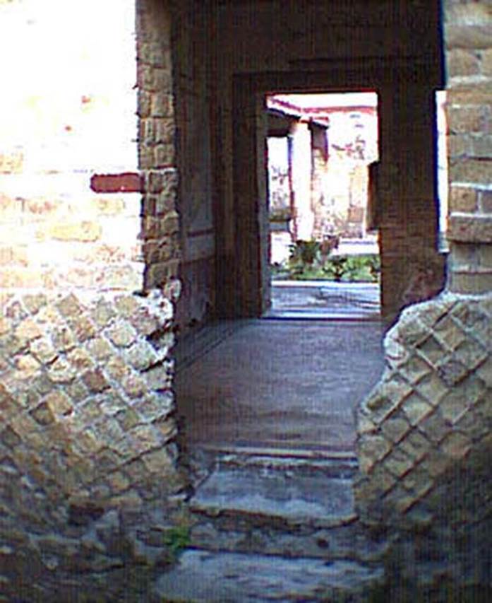VI.13/11, Herculaneum. Not dated. Looking through doorway in north wall of courtyard towards room 17.  Photo courtesy of Nicolas Monteix.
