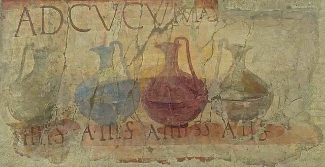 VI.13/14 Herculaneum, June 2017.  Enhanced part of the shop sign showing four jugs of different colours, naming and pricing the drinks sold here together with the shop sign AD CVCVMAS (Ad Cucumas), written above the jugs.
Photo courtesy of Michael Binns.
