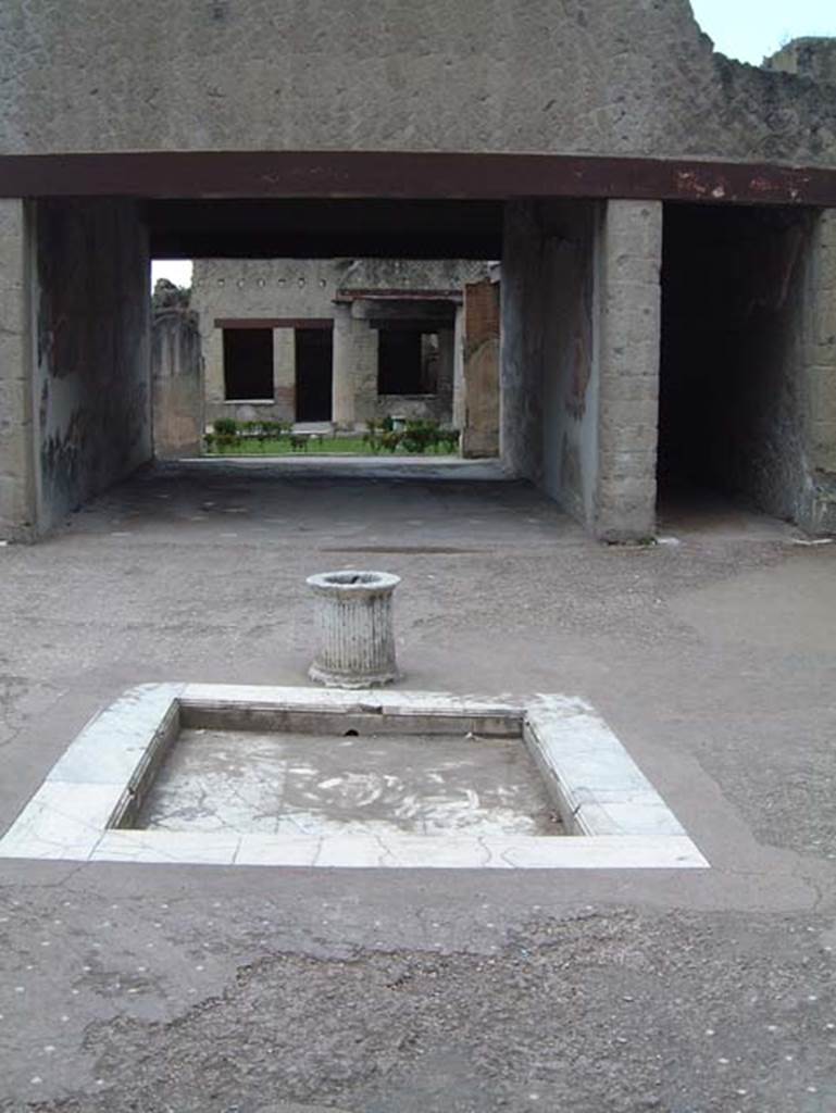 VI.13 Herculaneum, May 2001. Looking south across impluvium in atrium.  Photo courtesy of Current Archaeology.
