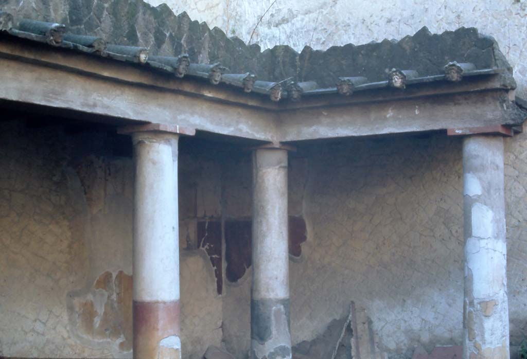 VI.17 Herculaneum. 4th December 1971. Looking towards south-east corner of peristyle.
Note: the water-spouts positioned on the roof.  Photo courtesy of Rick Bauer, from Dr George Fays slides collection.
