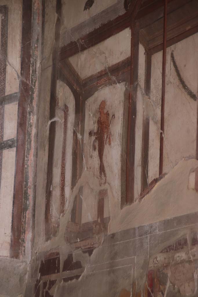 VI.17 Herculaneum. September 2019. Detail of painted figure from upper north end of east wall of triclinium. 
Photo courtesy of Klaus Heese.
