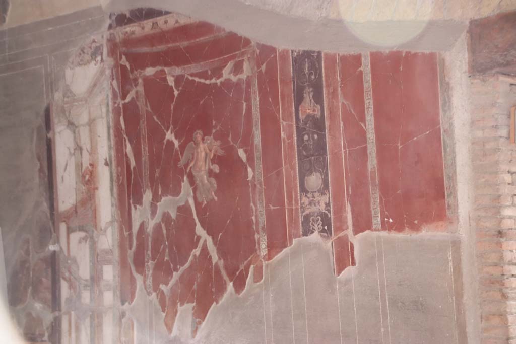 VI.17 Herculaneum. September 2019. Detail of painted decoration from east wall of triclinium, on north side of doorway. 
Photo courtesy of Klaus Heese.
