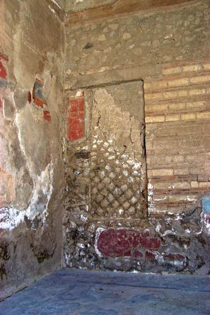 VI.17, Herculaneum. July 2003. South-east corner of tablinum, with blocked window in south wall.  
Photo courtesy of Nicolas Monteix.
