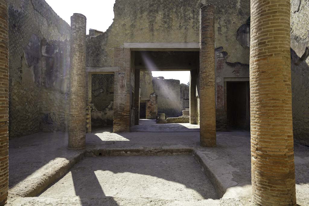VI.29 Herculaneum, August 2021. 
Room 3, looking east across impluvium in atrium towards tablinum, towards second atrium 9. Photo courtesy of Robert Hanson.


