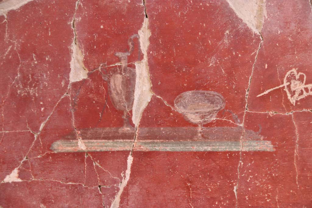 VI.29 Herculaneum. October 2020. Tablinum 5, detail of painted decoration in centre of panel at west end of south wall. Photo courtesy of Klaus Heese.