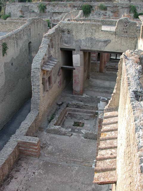 VI.29, Herculaneum. September 2003. 
Looking west from above triclinium, across second atrium towards south wall with lararium, and doorways to corridor and tablinum. Photo courtesy of Nicolas Monteix.


