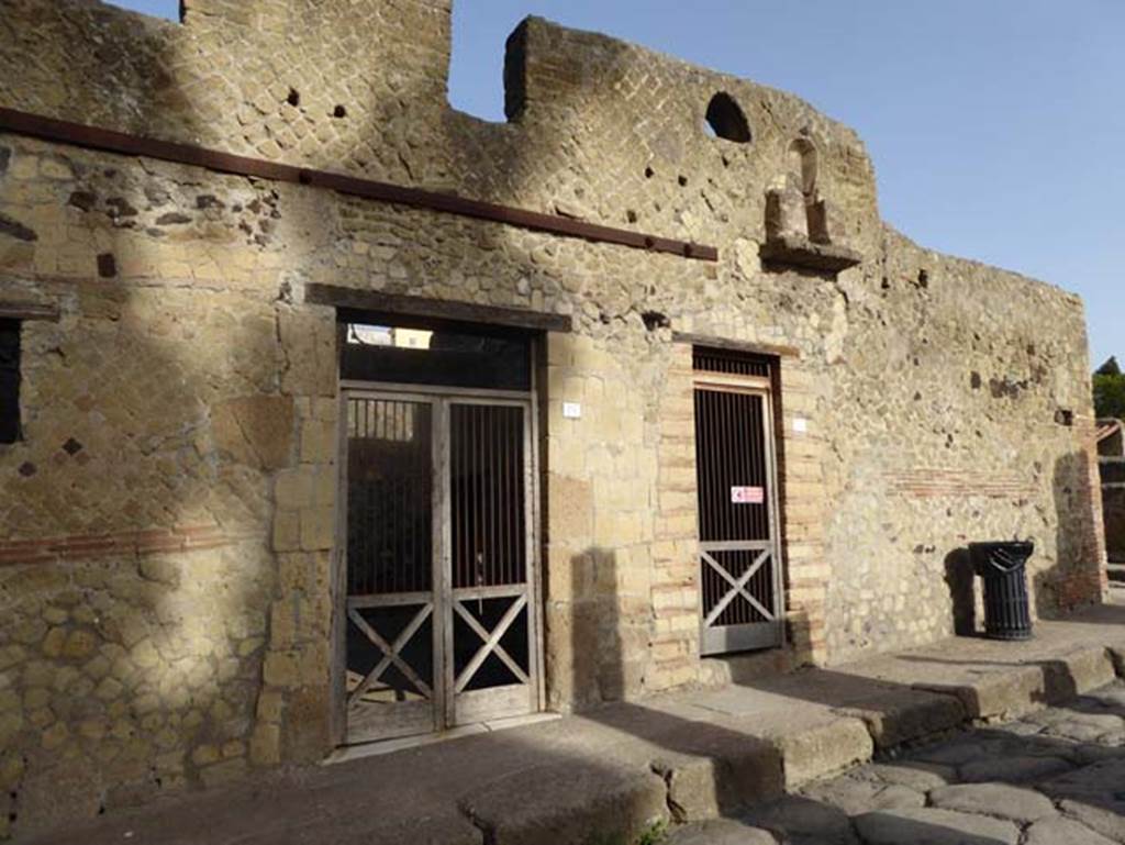 VII, 18 and 17, Herculaneum, October 2014. Doorways to workshop and dwelling on Decumanus Inferiore.  Photo courtesy of Michael Binns.
