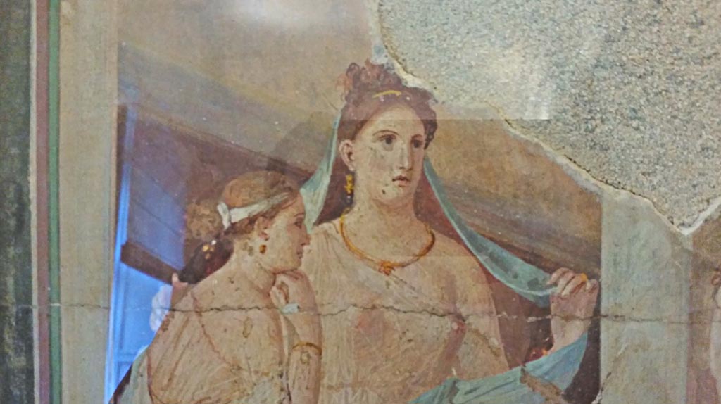 Ins. Orientalis II.4/19 Herculaneum. Detail from painting of girl having her hair dressed.
Now in Naples Archaeological Museum. Inventory number 9022. Photo courtesy of Giuseppe Ciaramella, November 2018.



According to Parslow, in February 1761 a shaft was sunk from one of the upper level rooms of the Palaestra down into one of the rooms flanking the great apsidal hall.
By luck this narrow shaft dropped directly onto a series of small mounted paintings resting on the mosaic floor and leaning up against one wall.
See Parslow, C. C. (1998). Rediscovering Antiquity, Cambridge Univ. Press, ((p.148-149, and fig.41) 

According to Grasso, these small mounted paintings were provenanced from Ins. Orientalis. II.4/19 and are now in Naples Archaeological Museum.
They include -
NAP 9019, p.164, no 47, 
NAP 9020, p.165, no 48, 
NAP 9021, p 163, no 46, 
NAP 9022, p.162, no 45, 
NAP 9726, p.135, no 25, 
NAP 9735, p.136, no 26,
NAP 8993, p.110, no.8, 
See Bragantini, I, and Sampaolo, V, eds. La Pittura Pompeiana. Naples, Electa. (See above for page numbers)
