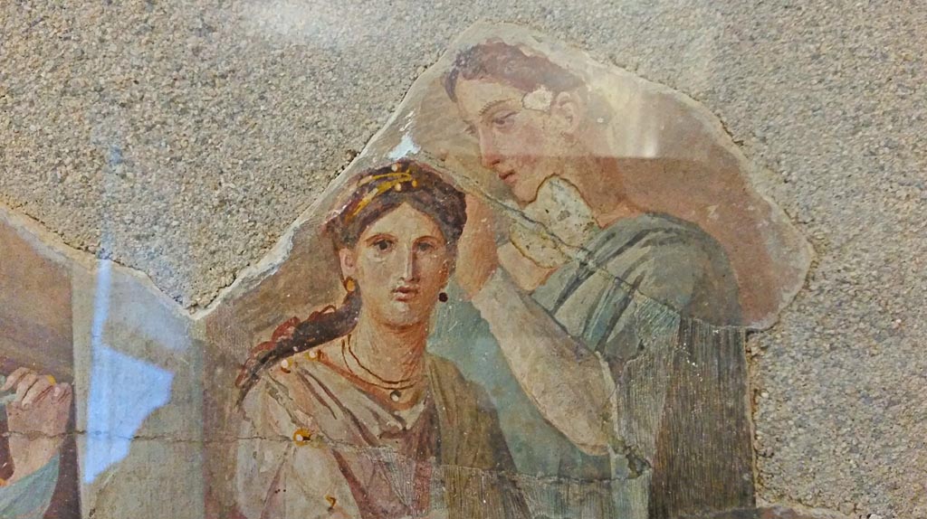 Ins. Orientalis II.4/19 Herculaneum. Detail from painting of girl having her hair dressed.
Now in Naples Archaeological Museum. Inventory number 9022. Photo courtesy of Giuseppe Ciaramella, November 2018.

According to Parslow, in February 1761 a shaft was sunk from one of the upper level rooms of the Palaestra down into one of the rooms flanking the great apsidal hall.
By luck this narrow shaft dropped directly onto a series of small mounted paintings resting on the mosaic floor and leaning up against one wall.
See Parslow, C. C. (1998). Rediscovering Antiquity, Cambridge Univ. Press, ((p.148-149, and fig.41) 

According to Grasso, these small mounted paintings were provenanced from Ins. Orientalis. II.4/19 and are now in Naples Archaeological Museum.
They include -
NAP 9019, p.164, no 47, 
NAP 9020, p.165, no 48, 
NAP 9021, p 163, no 46, 
NAP 9022, p.162, no 45, 
NAP 9726, p.135, no 25, 
NAP 9735, p.136, no 26,
NAP 8993, p.110, no.8, 
See Bragantini, I, and Sampaolo, V, eds. La Pittura Pompeiana. Naples, Electa. (See above for page numbers).
