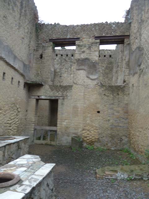 Ins. Orientalis II.6, Herculaneum. September 2015.
Looking towards east wall of shop/bar-room with doorways on the upper floor, as well as doorway to a rear room from the shop/bar-room.

