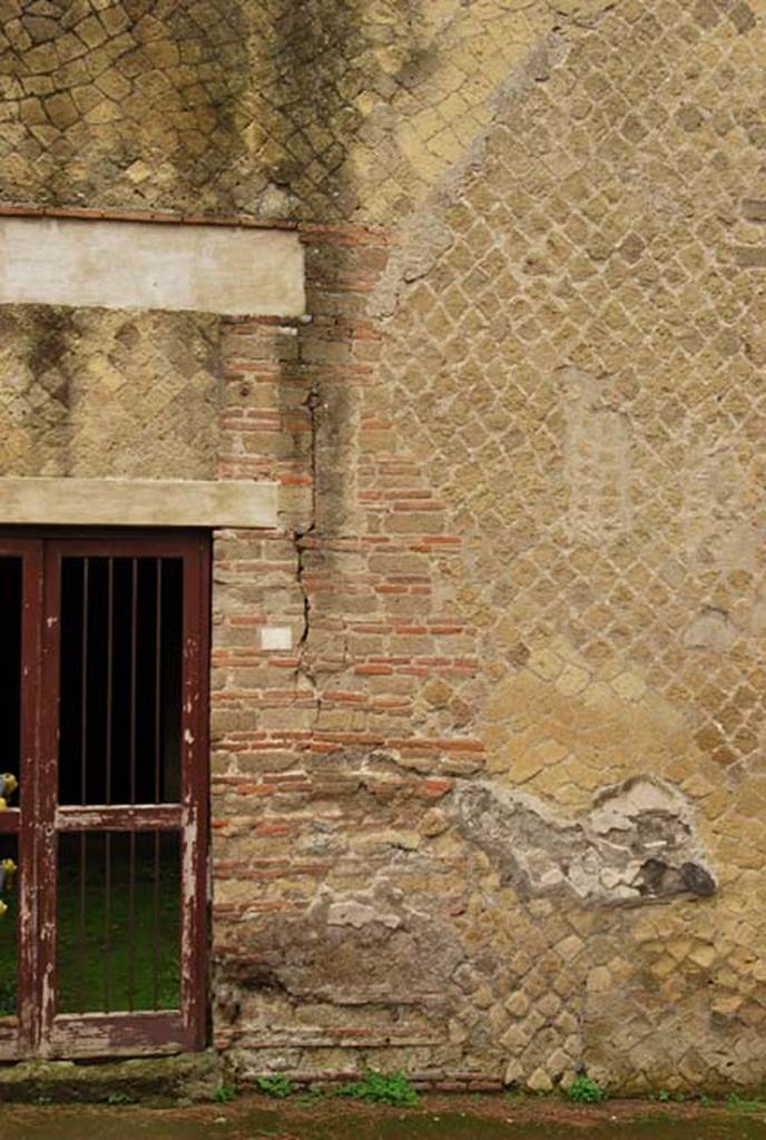 Ins. Orientalis II.9, Herculaneum. December 2008. Detail of façade on south side of entrance doorway. 
Photo courtesy of Nicolas Monteix.
