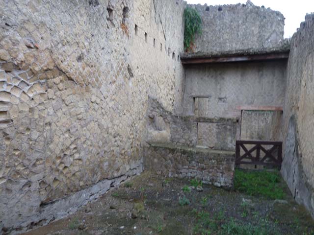 Ins. Orientalis II.15, Herculaneum. September 2015. 
Modern drain in north-west corner of workshop, site of latrine.
