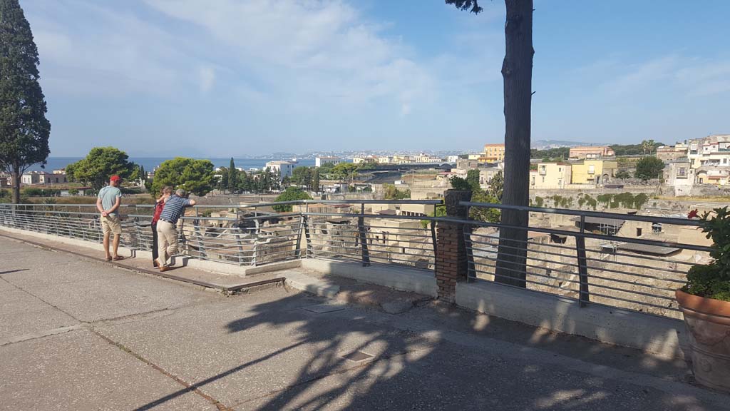 Herculaneum. September 2019. Looking across site below bridge, towards beautiful Bay of Naples. Photo courtesy of Klaus Heese.