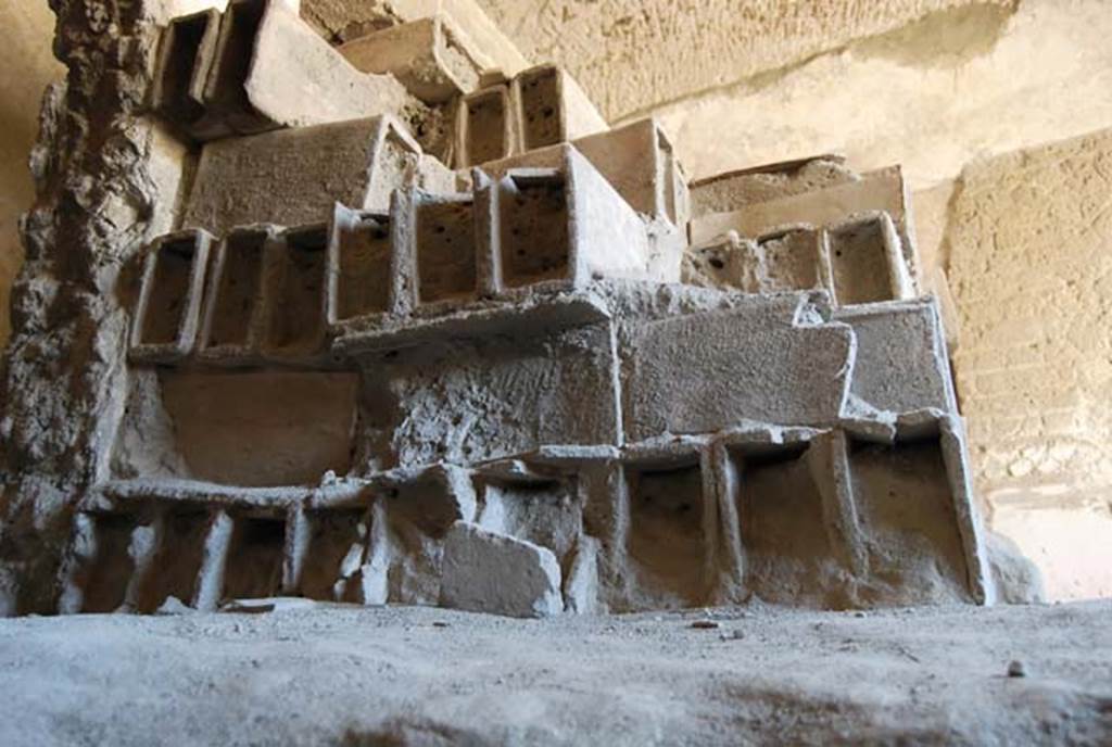 Suburban Baths, Herculaneum, April 2008. Terracotta tubes stacked in the Baths, and still awaiting installation as heating flues, completely filled with the dense ash from the pyroclastic flows. Photo courtesy of Nicolas Monteix.
