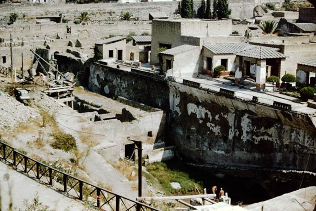Herculaneum, 1957. Looking north-west across site from access roadway towards the Sacred Area on the south side of the terraces of the Houses of the Mosaic Atrium, and of the Stags, on right.  Photo by Stanley A. Jashemski.
Source: The Wilhelmina and Stanley A. Jashemski archive in the University of Maryland Library, Special Collections (See collection page) and made available under the Creative Commons Attribution-Non Commercial License v.4. See Licence and use details. J57f0431
